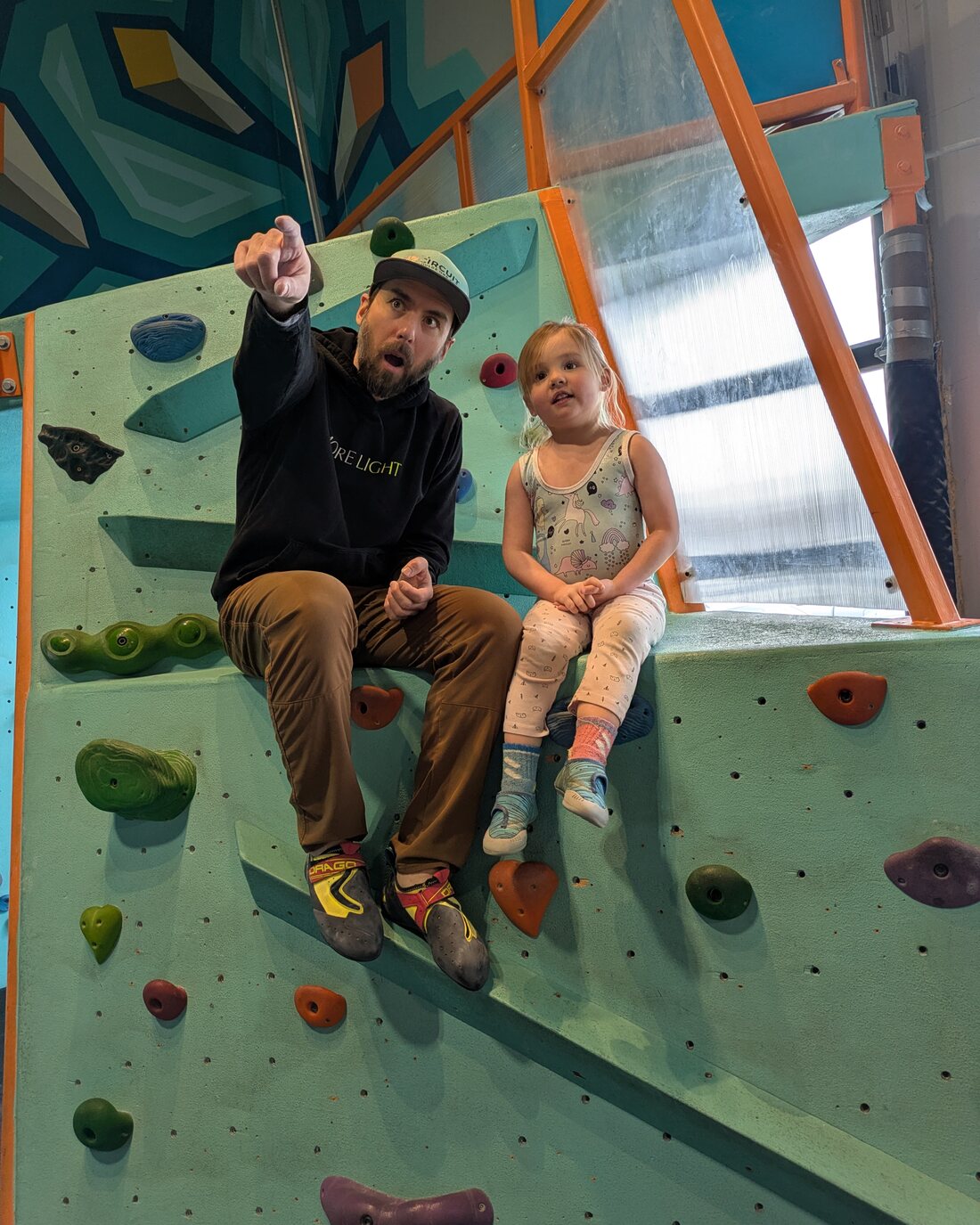 Dylan climbing with his daughter